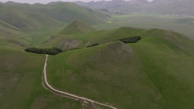 Aerial view of rolling green hills of Castelluccio Italy.
