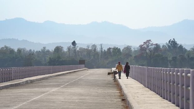 View of people walking on a bridge in Dhangadhi Nepal. View of people walking on a bridge in Dhangadhi Nepal.