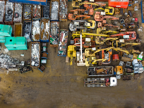Aerial view of scrapped cars and crushed metal debris piled in a junkyard and recycling site in Hoogeveen Drenthe Netherlands. Aerial view of scrapped cars and crushed metal debris piled in a junkyard and recycling site in Hoogeveen Drenthe Netherlands.