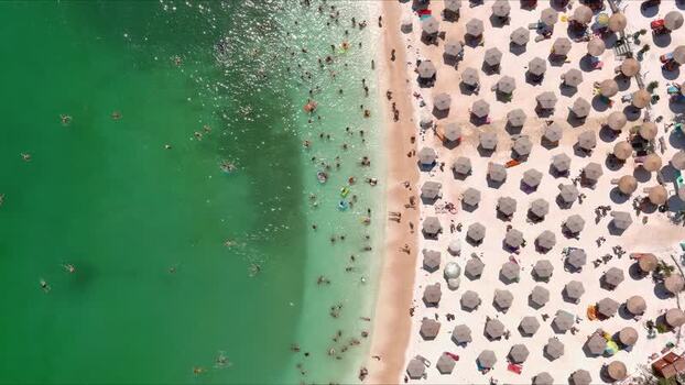 Aerial view of beach with umbrellas and swimmers Greece. Aerial view of beach with umbrellas and swimmers Greece.