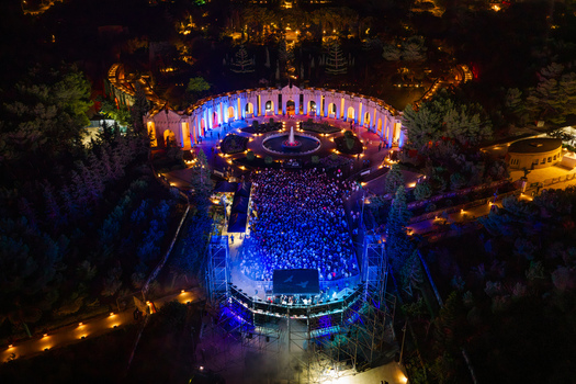Attard Malta 20 September 2026 Aerial view of Ta Qali National Park at night featuring a large crowd gathered for an outdoor concert in front of a stage with the illuminated Greek Theatre in the background. Attard Malta 20 September 2026 Aerial view of Ta Qali National Park at night featuring a large crowd gathered for an outdoor concert in front of a stage with the illuminated Greek Theatre in the background.