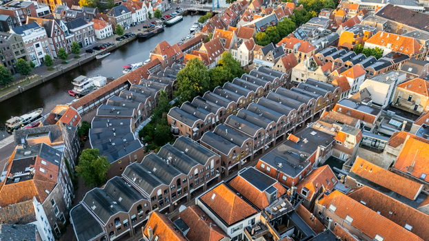 Aerial view of the historic city center with its characteristic orange rooftops narrow streets and a canal flowing through the urban landscape in Zwolle Overijssel Netherlands.