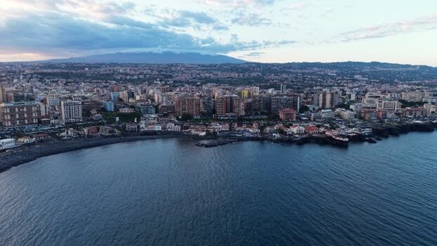 Aerial view of Catania city and Mount Etna at dusk Italy. Aerial view of Catania city and Mount Etna at dusk Italy.