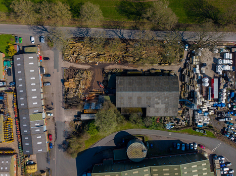 Aerial view of Ladfordfields Industrial Estate with industrial buildings timber storage and parking areas in Stafford England United Kingdom. Aerial view of Ladfordfields Industrial Estate with industrial buildings timber storage and parking areas in Stafford England United Kingdom.