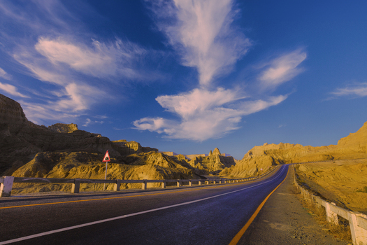 View of the Makran Coastal Highway winding through the arid rocky mountains of Balochistan Pakistan.