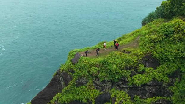 Aerial view of Bukit Pengilon cliffs and people Indonesia. Aerial view of Bukit Pengilon cliffs and people Indonesia.