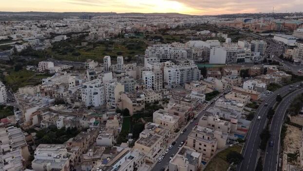 Aerial view of urban buildings and roads at sunset Malta. Aerial view of urban buildings and roads at sunset Malta.