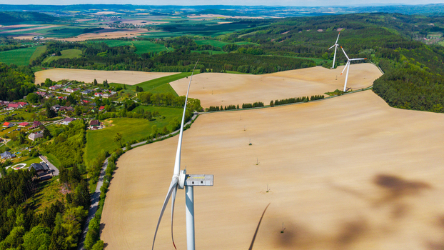 Aerial view of wind turbines at Zipotin wind farm standing in golden fields near the village of Gruna Pardubicky kraj Czechia. Aerial view of wind turbines at Zipotin wind farm standing in golden fields near the village of Gruna Pardubicky kraj Czechia.