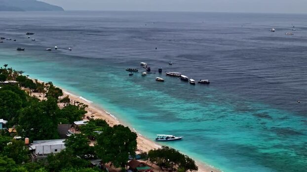 Aerial view of boats in the turquoise waters of Bali Indonesia.