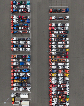 Aerial view of rows of semi trucks and trailers parked in an orderly lot at Ekkersrijt 2037 in Son Noord Brabant Netherlands.