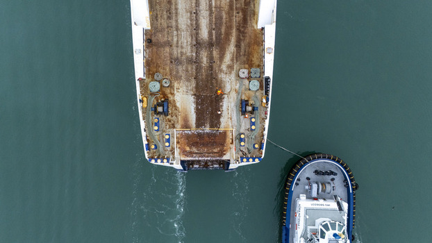 Nelson New Zealand 07 April 2026 Aerial view of a large vessel being assisted by a tugboat in the turquoise waters of Port Nelson. Nelson New Zealand 07 April 2026 Aerial view of a large vessel being assisted by a tugboat in the turquoise waters of Port Nelson.