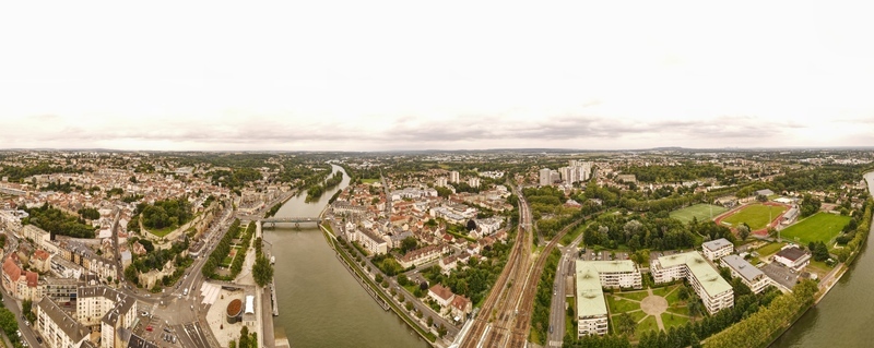Aerial view of the historic town of Pontoise featuring the Oise River urban architecture railway tracks and green parks in Pontoise Ile de France France. Aerial view of the historic town of Pontoise featuring the Oise River urban architecture railway tracks and green parks in Pontoise Ile de France France.