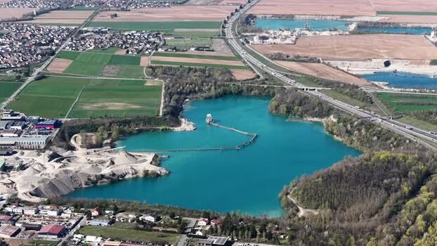 Aerial view of blue lake and highway France.