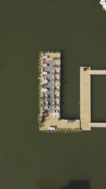 Aerial view of floating pier restaurant in Italy.