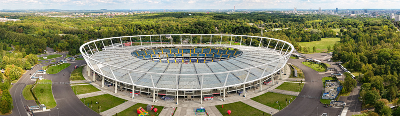 Chorzow Poland 17 September 2026 Aerial view of Silesian Stadium surrounded by lush green parkland and trees under a bright sky.