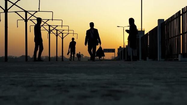 View of people walking at sunset in Bogura Bangladesh. View of people walking at sunset in Bogura Bangladesh.