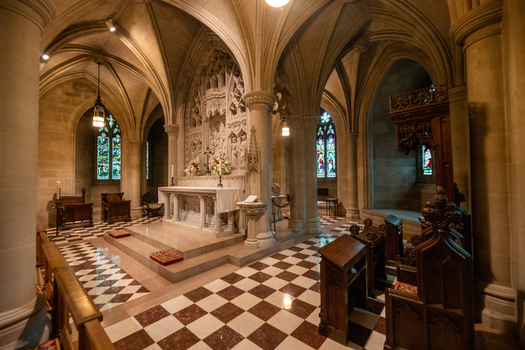 Washington District of Columbia United States 06 May 2025 View of the altar at Washington National Cathedral with stone carvings stained glass and marble floors.