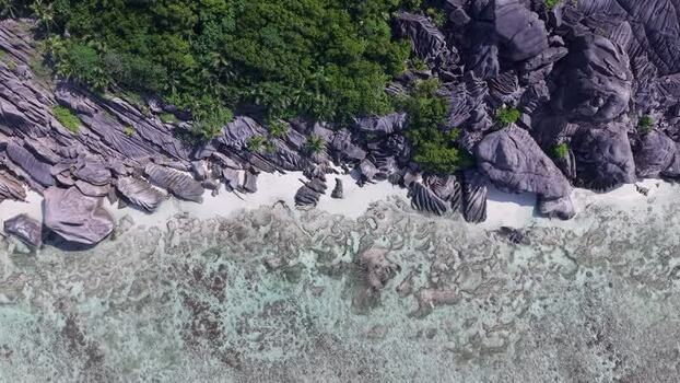 Aerial view of Anse Reunion beach and granite boulders Seychelles.