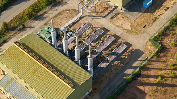 Aerial view of the Infinis Power Station featuring industrial chimneys and metal rooftops in Stewartby England United Kingdom. Aerial view of the Infinis Power Station featuring industrial chimneys and metal rooftops in Stewartby England United Kingdom.