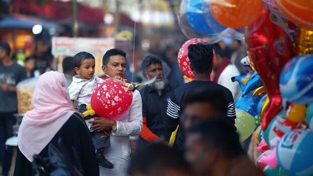 View of a crowded market with people and balloons in Bangladesh. View of a crowded market with people and balloons in Bangladesh.