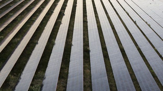 Aerial view of rows of solar panels in a solar farm in Poland. Aerial view of rows of solar panels in a solar farm in Poland.
