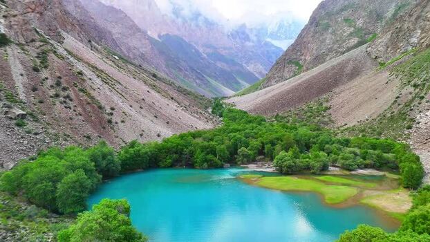 Aerial view of a turquoise lake near Qullai Vudor Tajikistan. Aerial view of a turquoise lake near Qullai Vudor Tajikistan.