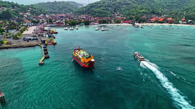 Aerial view of a ferry and coastal town in Bali Indonesia.