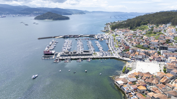 Aerial view of the marina and historic stone houses along the coastline in Combarro Pontevedra Spain. Aerial view of the marina and historic stone houses along the coastline in Combarro Pontevedra Spain.