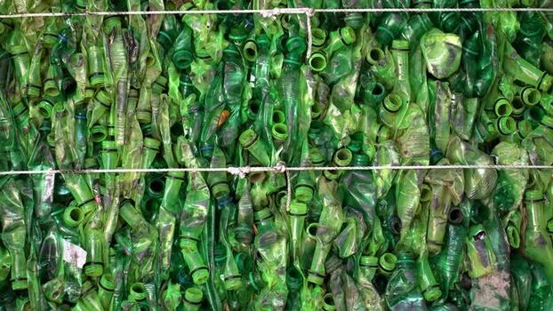 View of crushed green plastic bottles in Bogura Bangladesh. View of crushed green plastic bottles in Bogura Bangladesh.