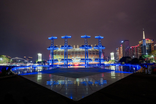 Guangzhou China 24 February 2024 View of the illuminated Haixinsha Asian Games Park with its iconic sail shaped structures reflecting in the water at night. Guangzhou China 24 February 2024 View of the illuminated Haixinsha Asian Games Park with its iconic sail shaped structures reflecting in the water at night.