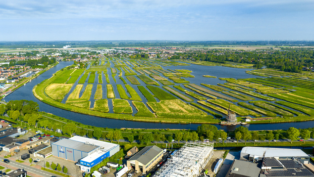 Aerial view of the Oosterdel nature reserve with its unique network of small islands and water channels under a clear sky in Broek op Langedijk Noord Holland Netherlands. Aerial view of the Oosterdel nature reserve with its unique network of small islands and water channels under a clear sky in Broek op Langedijk Noord Holland Netherlands.