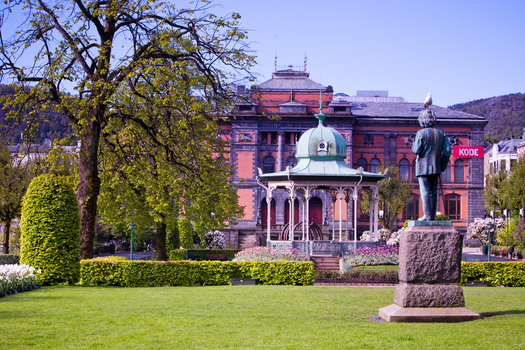 View of a statue standing proudly in a park with a bandstand set against the backdrop of a grand brick building West Old Town New Mexico Sweden. View of a statue standing proudly in a park with a bandstand set against the backdrop of a grand brick building West Old Town New Mexico Sweden.