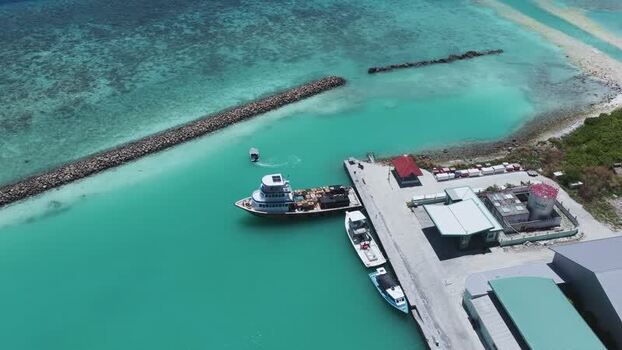 Aerial view of boats docked at a harbor in Kudahuvadhoo Maldives.