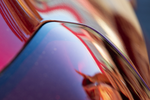 View of vibrant reflections dancing across the glossy surface a symphony of red brown and blue hues in Mechanisch Erfgoed Centrum Dronten Flevoland Netherlands. View of vibrant reflections dancing across the glossy surface a symphony of red brown and blue hues in Mechanisch Erfgoed Centrum Dronten Flevoland Netherlands.