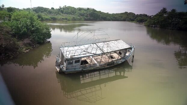 View of an abandoned boat on a river Sri Lanka. View of an abandoned boat on a river Sri Lanka.