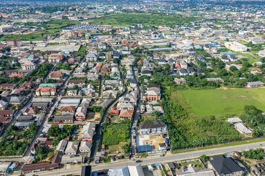 Port Harcourt Nigeria 03 July 2026 Aerial view of the urban landscape of Port Harcourt featuring residential houses green spaces and paved roads under a clear sky. Port Harcourt Nigeria 03 July 2026 Aerial view of the urban landscape of Port Harcourt featuring residential houses green spaces and paved roads under a clear sky.