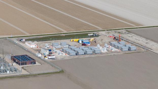 Espel Netherlands 04 April 2026 Aerial view of the Giga Buffalo battery storage facility under construction near Westermeerdijk with rows of grey units surrounded by flat fields.