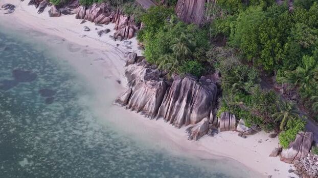 Aerial view of Praslin granite boulders and beach Seychelles.