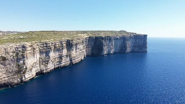 Aerial view of the high limestone cliffs at Dwejra Bay Malta. Aerial view of the high limestone cliffs at Dwejra Bay Malta.