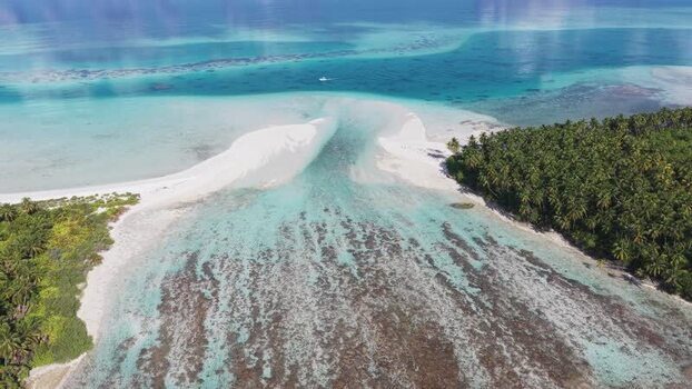 Aerial view of tropical island with turquoise water Maldives.