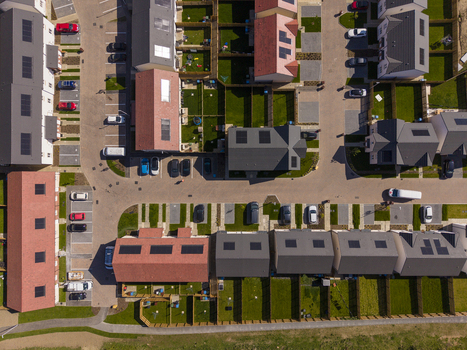 Linlithgow United Kingdom 29 April 2026 Aerial view of a modern residential housing estate featuring rooftops with solar panels private gardens and parked cars. Linlithgow United Kingdom 29 April 2026 Aerial view of a modern residential housing estate featuring rooftops with solar panels private gardens and parked cars.