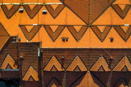 Aerial view of the intricate terracotta tiled roofs with triangular gables and geometric patterns in Belgrade City of Belgrade Serbia. Aerial view of the intricate terracotta tiled roofs with triangular gables and geometric patterns in Belgrade City of Belgrade Serbia.