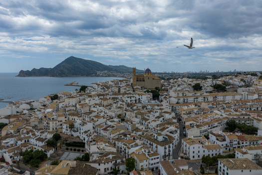 Aerial view of the historic town of Altea with its iconic blue domed church white washed houses and coastal landscape in Altea Valencian Community Spain.