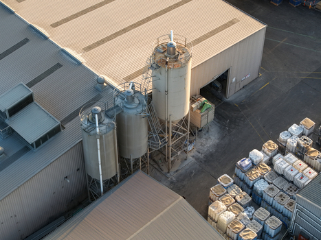 Melbourne Australia 22 September 2026 Aerial view of industrial factories in Kilsyth featuring metal silos and storage containers in the yard. Melbourne Australia 22 September 2026 Aerial view of industrial factories in Kilsyth featuring metal silos and storage containers in the yard.
