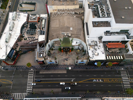 Los Angeles United States 25 September 2026 Aerial view of the iconic TCL Chinese Theatre on the Hollywood Walk of Fame surrounded by urban buildings palm trees and city streets.