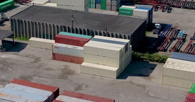 Aerial view of shipping containers in an industrial yard United States. Aerial view of shipping containers in an industrial yard United States.
