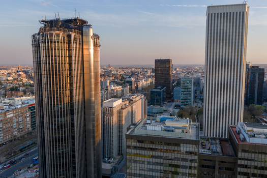 Aerial view of the modern skyscrapers in the Cuatro Torres Business Area featuring glass facades steel structures and urban surroundings in Madrid Community of Madrid Spain.