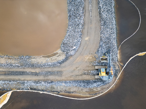 Oulu North Ostrobothnia Finland 18 September 2026 Aerial view of an excavator working on a gravel embankment between two bodies of water at a construction site. Oulu North Ostrobothnia Finland 18 September 2026 Aerial view of an excavator working on a gravel embankment between two bodies of water at a construction site.