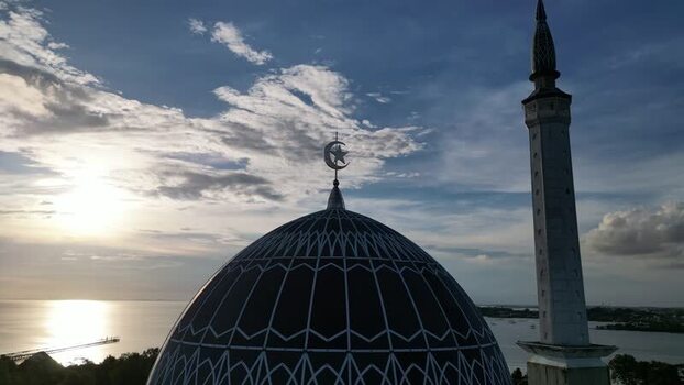 Aerial view of Masjid Raya Nur Ilahi at sunset Indonesia. Aerial view of Masjid Raya Nur Ilahi at sunset Indonesia.