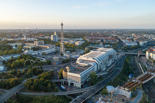 Aerial view of the Internationales Congress Centrum Berlin a prominent example of brutalist architecture surrounded by urban infrastructure and greenery in Berlin Berlin Germany. Aerial view of the Internationales Congress Centrum Berlin a prominent example of brutalist architecture surrounded by urban infrastructure and greenery in Berlin Berlin Germany.